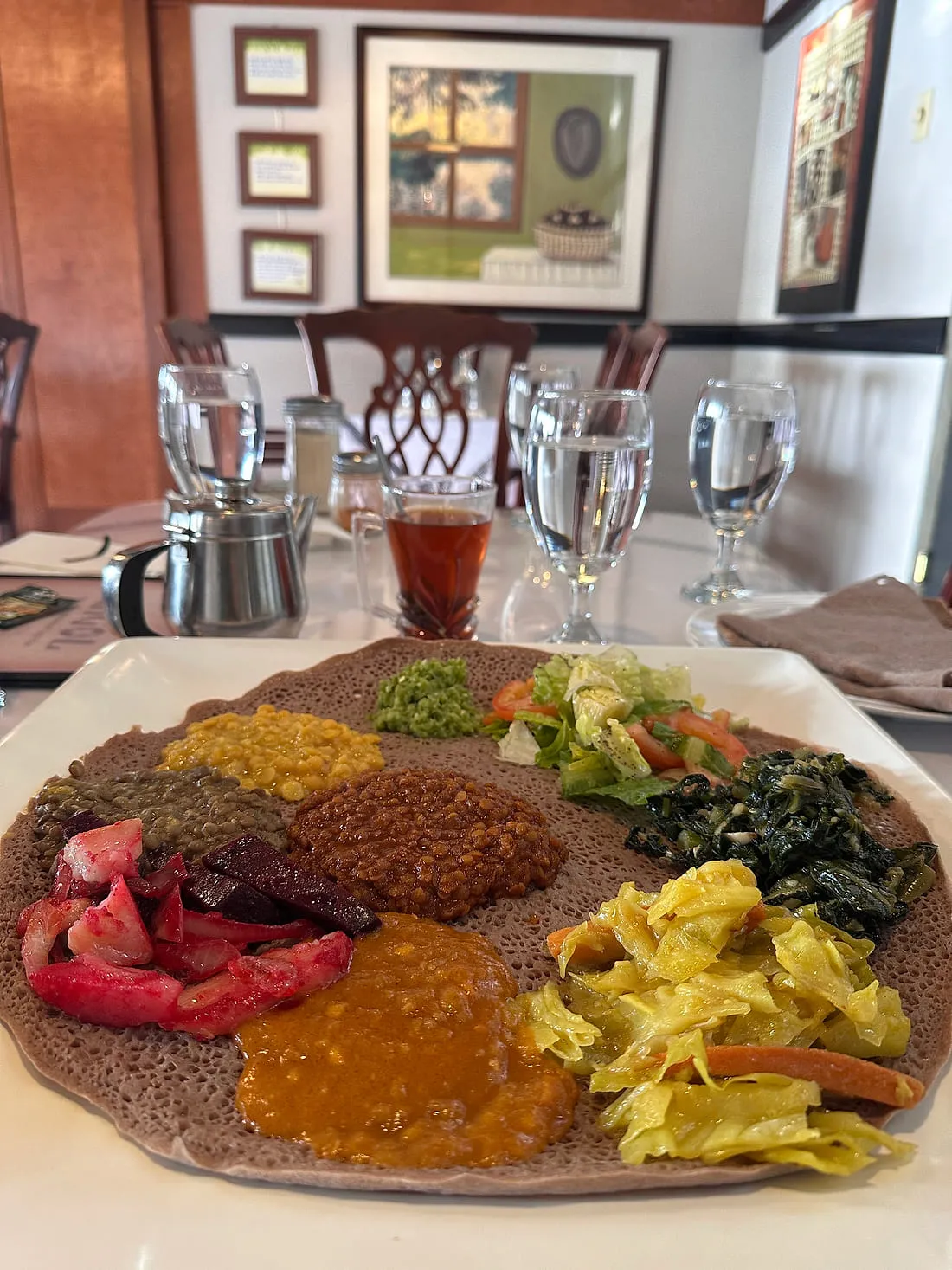 Vegetarian combination platter at Zagol with split peas, lentils, collard greens, cabbage with carrot, beets and salad